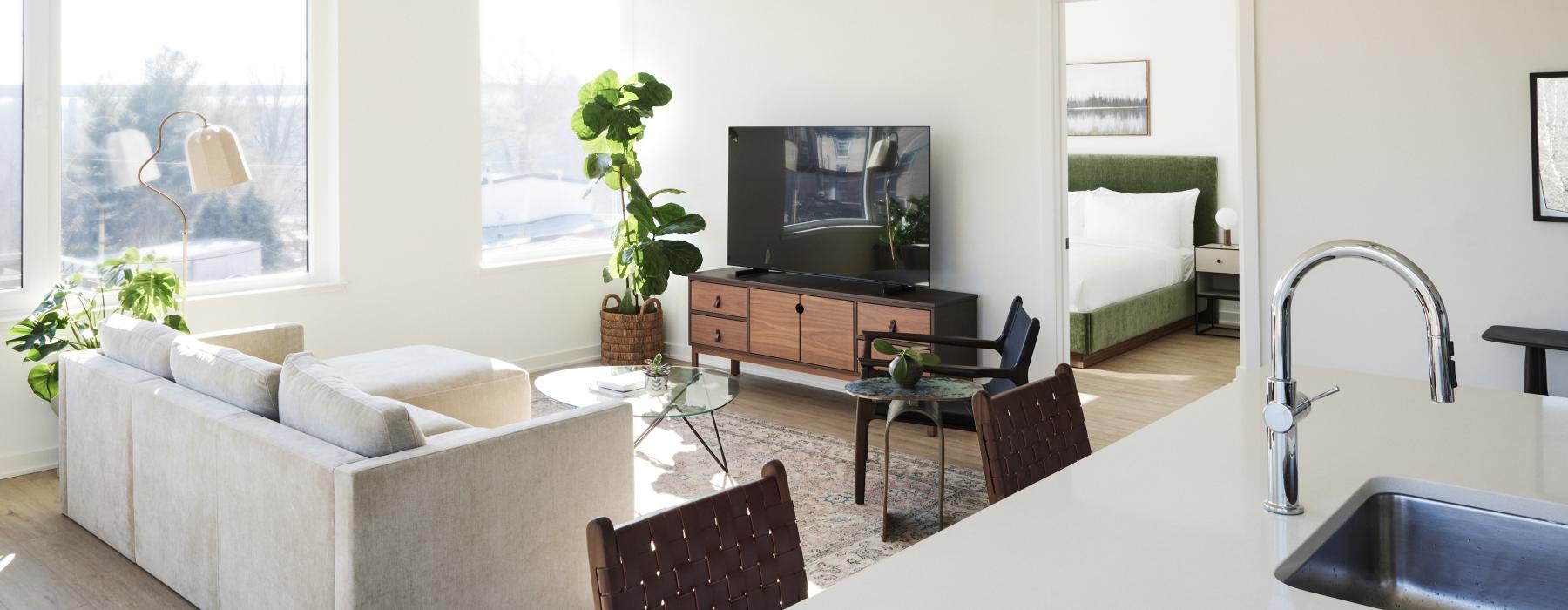 a living room with a tv and couches