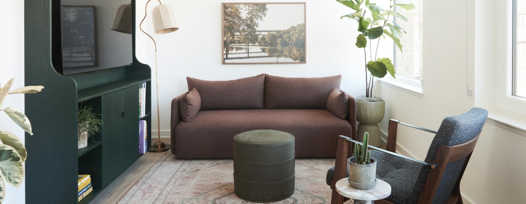 a living room with a couch and a tv